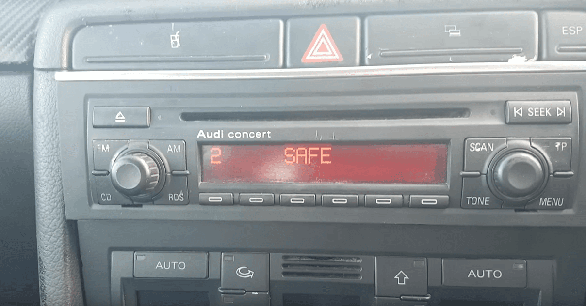 Close-up of a Volkswagen radio display showing the SAFE 2 lockout message